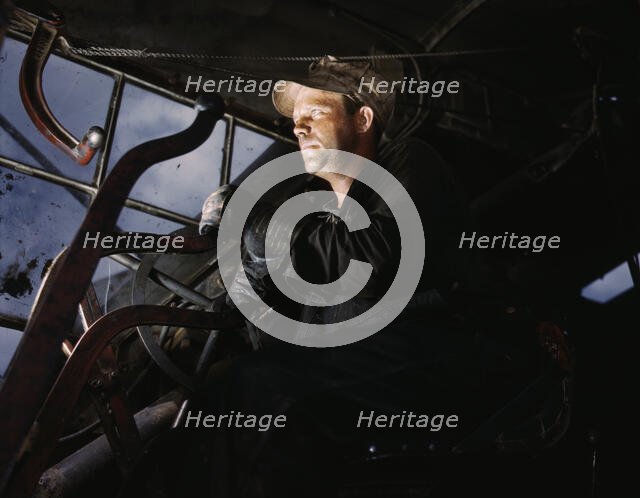 Crane operator at TVA's Douglas Dam, Tennessee, 1942. Creator: Alfred T Palmer.