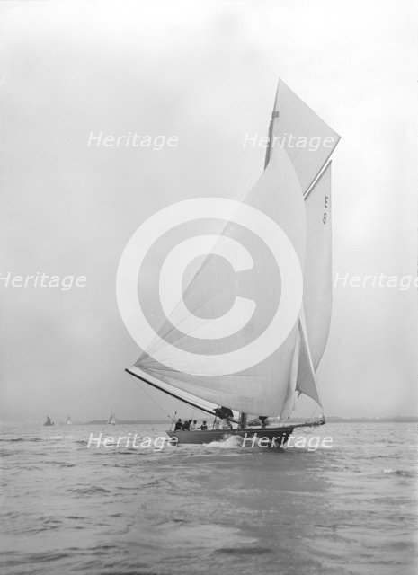 Gold medal winner 'Rollo' races downwind under spinnaker, 1911. Creator: Kirk & Sons of Cowes.