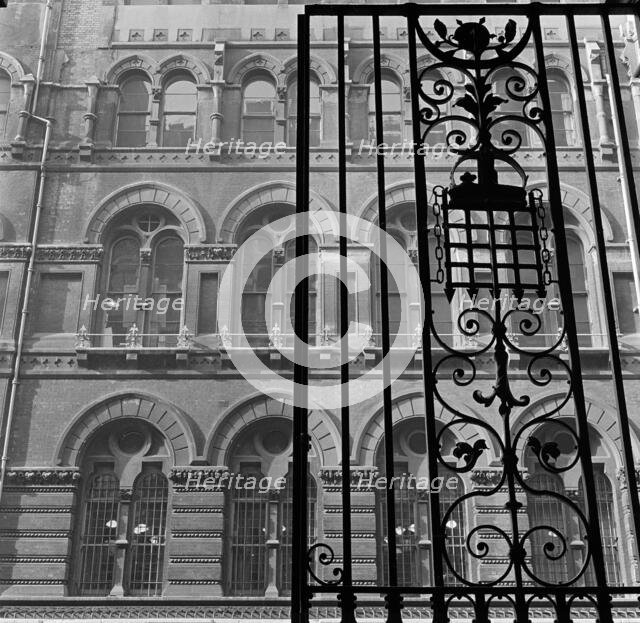 Looking up past the ornate iron gates of Westminster Palace Gardens to the facade...London, 1965-75. Creator: John Gay.