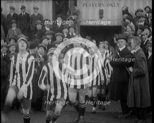 Women Football Players Walking Out Onto the Pitch, 1920. Creator: British Pathe Ltd.