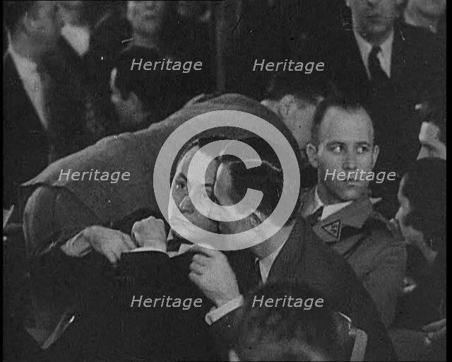 Bruno Richard Hauptmann Speaking To Attorney C. Lloyd Fisher During His Trial in the Lind..., 1930s. Creator: British Pathe Ltd.