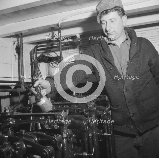 On board the fishing boat Alden, out of Gloucester, Massachusetts, 1943. Creator: Gordon Parks.