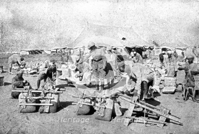 ''La Turquie Succombe; L'inspection des selles des chameaux employes aux transports', 1918. Creator: Unknown.