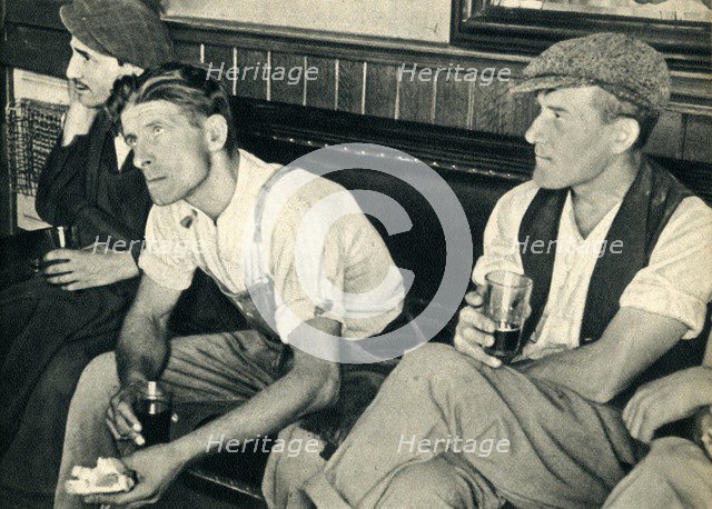 'Workmen in an English inn listening to Mr. Churchill', 1942. Creator: Unknown.