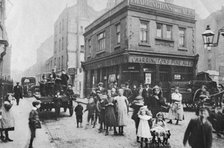 Busy East End street scene, London, 1912. Artist: Unknown