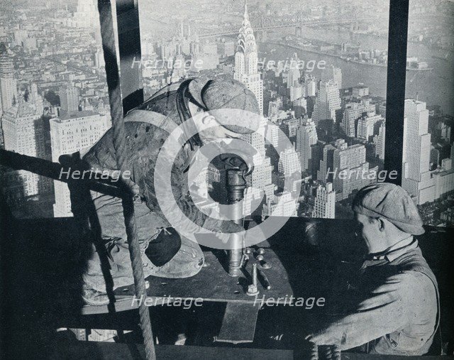 'Rivetting the last bolts on The Morning Mast of the Empire State building', c1931. Artist: Lewis Wickes Hine.