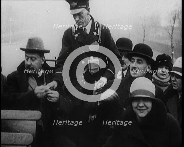 Bus Conductor Collecting Fares on the Open Top of a Bus, 1922. Creator: British Pathe Ltd.