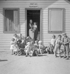 While the mothers are working in the fields, the preschool children..., Kern migrant camp, 1936. Creator: Dorothea Lange.
