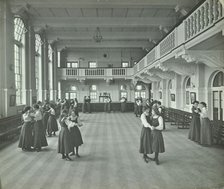 Girls dancing in the assembly hall, Clapham Secondary School, London, 1910. Artist: Unknown.