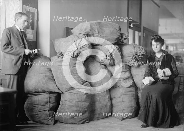 Post Office Department - Dead Letter Mail, Supt. Marvin Mclean And Mrs. Clara R.A. Nelson, 1917. Creator: Harris & Ewing.