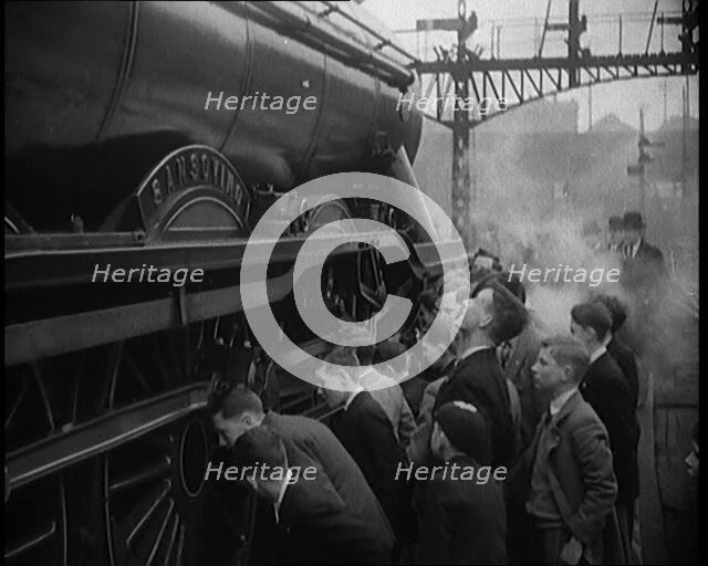 Boys Staring at a Steam Locomotive, 1931. Creator: British Pathe Ltd.