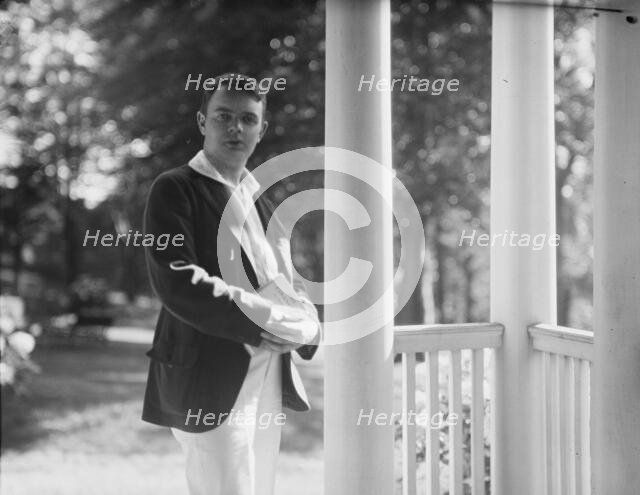 Leslie, Margeurite, friend of, standing on a porch, 1917 Aug. 18. Creator: Arnold Genthe.