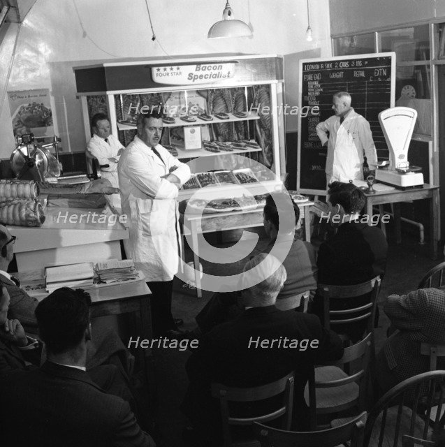 Butcher from Danish Bacon giving a demonstration, Kilnhurst, South Yorkshire, 1961.  Artist: Michael Walters