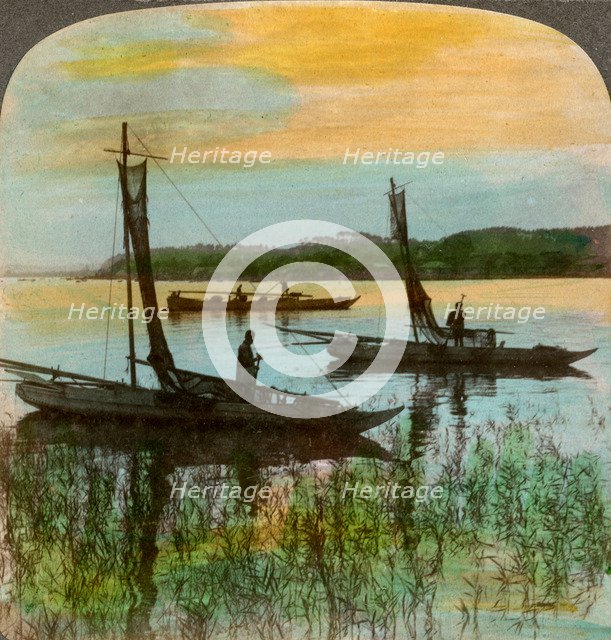 Fishing boats at sunset near Yokohama, Japan, 1904.Artist: Underwood & Underwood