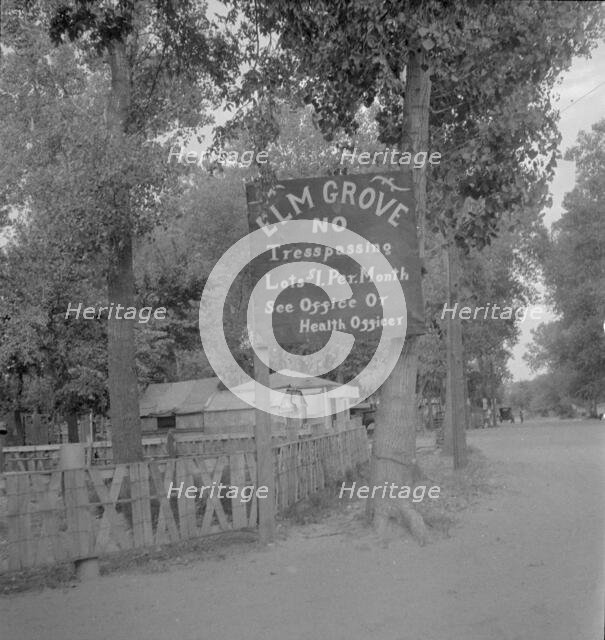 On the outskirts of a modern Oklahoma City within sight of its gleaming skyscrapers, 1936. Creator: Dorothea Lange.
