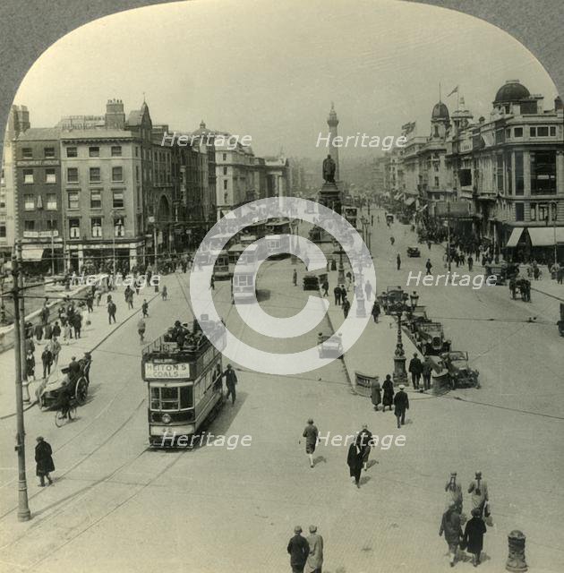 'The O'Connell Monument and the Nelson Pillar, O'Connell Street, Dublin, Ireland', c1930s. Creator: Unknown.