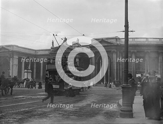 Street scene with electric tram in front of old Irish Paliament building, Dublin, Ireland, c1895. Creator: Robert Augustus Henry L'Estrange.