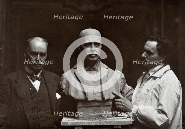 Sir Ronald Ross standing next to a bust of himself, and Janko Bragovitch (sculptor), 1926. Creator: Grove, Son and Boulton.