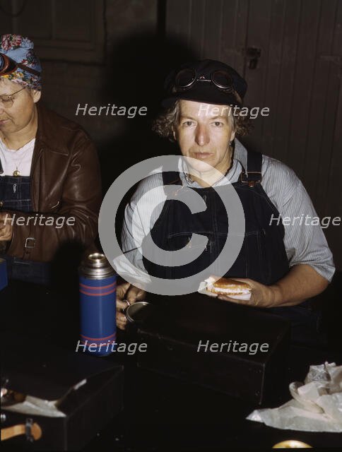 C. & N.W. R.R., Mrs. Elibia Siematter, employed as a sweeper at the roundhouse, Clinton, Iowa, 1943. Creator: Jack Delano.