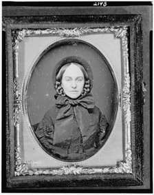Unidentified woman, head-and-shoulders portrait, facing front, between 1851 and 1860. Creator: Rufus Anson.