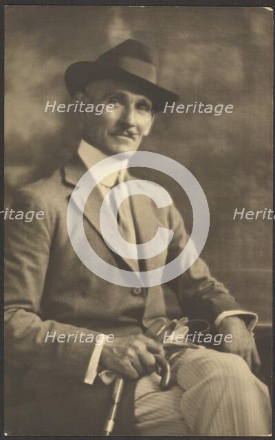Portrait of a Man Holding Cane and Gloves, 1907-1943. Creator: Louis Fleckenstein.