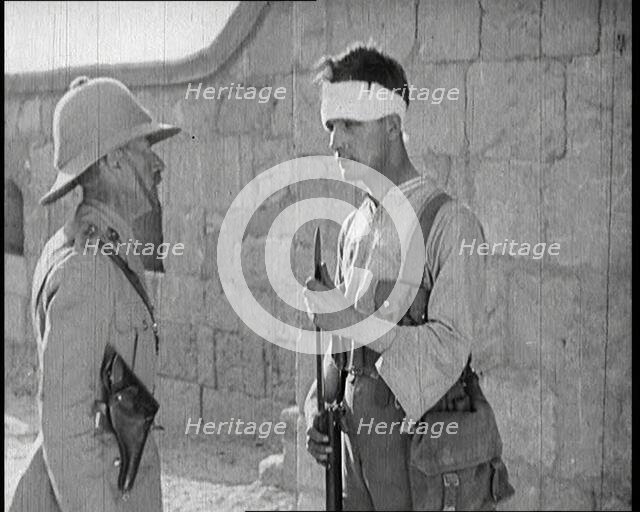 Scene from a Film: Male Actor Playing a Survivor from the Battle Being Questioned..., 1920s. Creator: British Pathe Ltd.