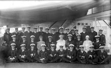 King George V and Queen Mary with the crew of 'HMY Victoria and Albert', c1935.  Creator: Kirk & Sons of Cowes.