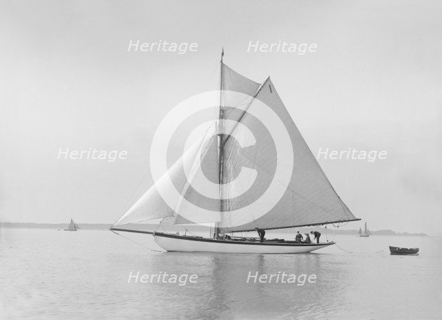 The cutter 'Wenda' in light winds, 1912. Creator: Kirk & Sons of Cowes.
