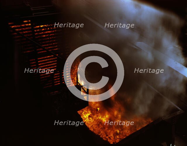 Coke being pushed into a quenching car, Hanna...Great Lakes Steel Corporation, Detroit, Mich., 1942. Creator: Arthur S Siegel.