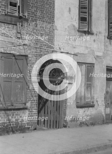 Facades of multi-story buildings, New Orleans or Charleston, South Carolina, between 1920 and 1926. Creator: Arnold Genthe.