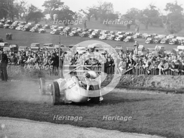 Dick Seaman with his Mercedes, Donington Grand Prix, 1938. Artist: Unknown