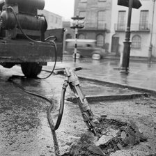 Road works with pneumatic drill, London, 1960-1965. Artist: John Gay