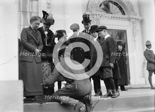 Boy Scouts - Visit of Sir Robert Baden-Powell To D.C. Making Fire; Mrs. Taft Watching, 1911. Creator: Harris & Ewing.