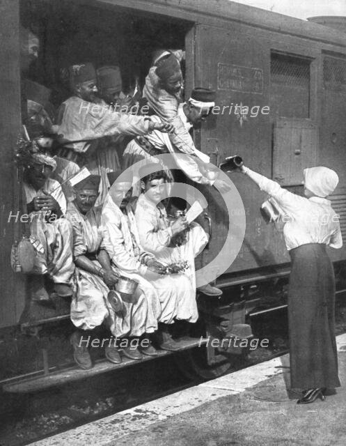 ''Les Turcos; Un arret dans une Gare d'un train de Tirailleurs', 1914. Creator: Unknown.