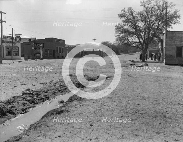 Main street of town showing irrigation ditch, Escalante, Utah, 1936. Creator: Dorothea Lange.