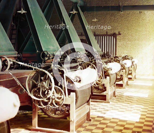 Cotton textile mill interior with machines producing cotton thread, probably..., between 1905-1915. Creator: Sergey Mikhaylovich Prokudin-Gorsky.
