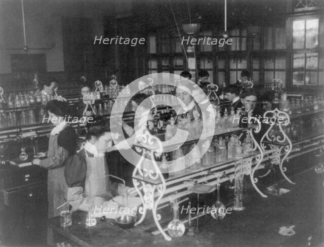 Students in a chemistry class conducting an experiment, Western High School, Washington DC, (1899?). Creator: Frances Benjamin Johnston.