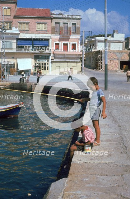 Children fishing in the harbour of Khania. Artist: Unknown