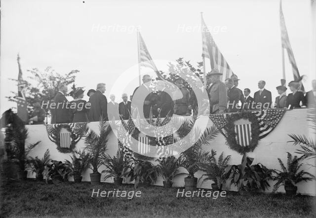 Cavalry Review By President Wilson - Seen In Stand: President Wilson; General Wood; Col..., 1913. Creator: Harris & Ewing.