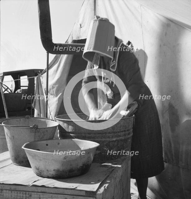Texas woman in carrot pullers' camp, Imperial Valley, California, 1939. Creator: Dorothea Lange.