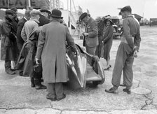 People examining Leon Cushman's Austin 7 racer at Brooklands for a speed record attempt, 1931. Artist: Bill Brunell.