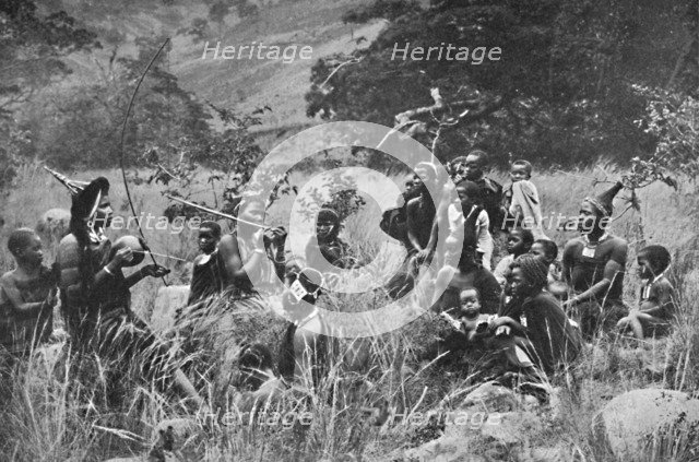 A Zulu musician and audience, 1912. Artist: Unknown.