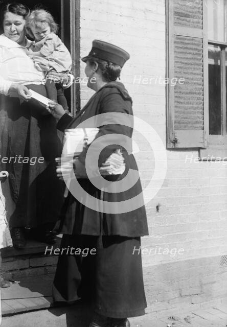 Mrs. Parmlee Campbell, Woman Mail Carrier - Delivering Mail..., 1917 Creator: Harris & Ewing.