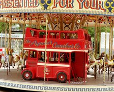 Children's carousel at a funfair in Street, Somerset, c2000.  Artist: M Hesketh-Roberts