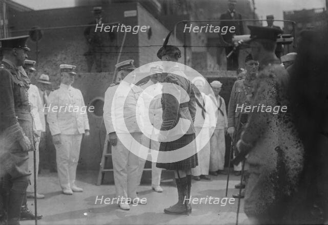 Captain Adams receiving "Kilties" on U.S.S. Recruit, July 1917. Creator: Bain News Service.