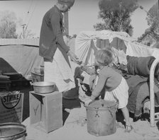 Drought refugees in migratory agricultural workers' camp, California, 1937. Creator: Dorothea Lange.