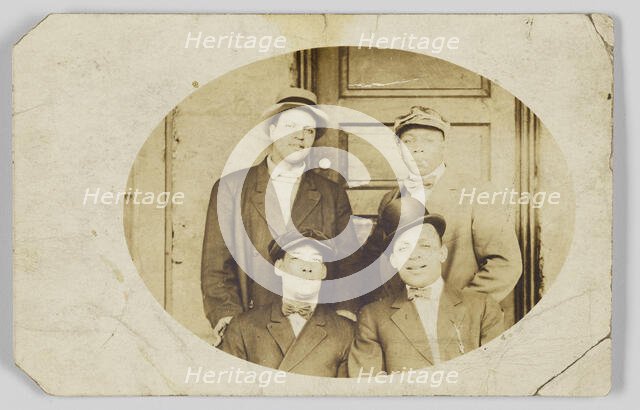 Photographic postcard of four unidentified men, 1906-1915. Creator: Unknown.