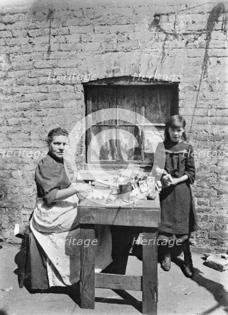 Assembling match boxes at home, 1900s. Artist: John Galt