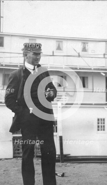 Uniformed man smoking a cigar, between c1900 and 1916. Creator: Unknown.