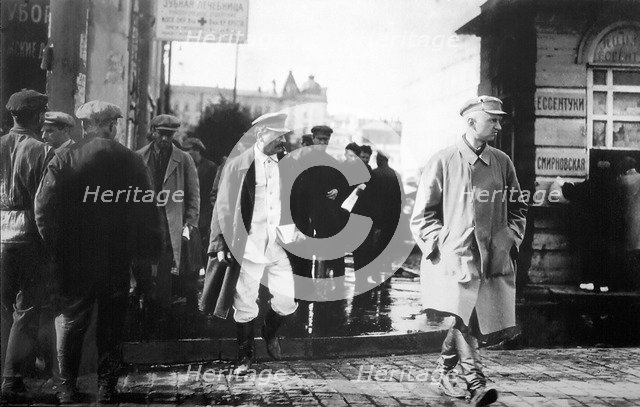 Soviet leader Joseph Stalin escorted by GRU secret agents, late 1920s. Artist: Anon